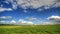 4K. Timelapse clouds over the green field. FULL HD, 4096x2304.