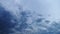 4K timelapse dark clouds in blue sky