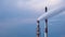 4k timelapse footage of two stacks of combined heat and power station against dark blue sky and clouds. White smoke