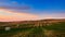 4K Timelapse of hay bales on the field at sunset, Tuscany, Italy