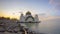 4K Timelapse of majestic Malacca Straits Mosque during sunrise. TILT DOWN EFFECT