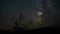 4k Timelapse movie film clip of moonset sunset with star trails in night sky. The Milky Way galaxy rotating over the