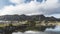 4k Timelapse movie film clip of village at Lofoten Islands in Norway on a blue sky with clouds sunny day and reflection