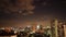 4k timelapse of Mumbai city dramatic night skyline with moving clouds cloudy sky & moon over city