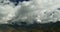 4k timelapse puffy clouds mass rolling over Tibet mountaintop,roof of the World.