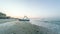 4K timelapse of sunrise over the beach near the sea. Sunrise meadow timelapse over the sea. Catamaran stands near the