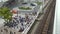 4K Train travels over railroad bridge in Tokyo. Trains in railway station