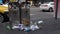 4K Trash spilling out of overfilled trash can on city street Taipei. Taiwan