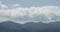 4K Turbulent mountain Cloud,white puffy cloud mass rolling over mountaintop.