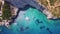 4K UHD Aerial view of Agios Nikolaos blue caves in Zakynthos Zante island, in Greece