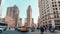 4K UHD time-lapse of car traffic and people walking at Flatiron building district, New York City, USA. American city life