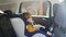 4k video of adorable baby boy sitting in child car safety seat