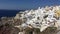 4k video. amazing romantic white houses in Oia, Santorini island, Greece. with a panoramic view of the whole cliff