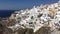 4k video. amazing romantic white houses in Oia, Santorini island, Greece. with a panoramic view of the whole cliff