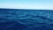 4K video of blue waves of Atlantic ocean near Maderia island, Portugal. It is a shot from a moving motorboat across the