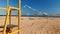 4k video of camera moving along empty sea beach with field for volleyball at bright sunny day