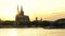 4K video clip of sunset behind Cologne Cathedral with a boat sailing on the River Rhine, Germany