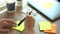 4k video of Close up image of business man Hand holding pen writing paper note at table in office