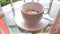 4K video, hot water is poured into a white porcelain cup with instant coffee powder, a quick preparation of fragrant