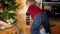 4k video of little smiling boy having fun and playing with toy train and railroad under Christmas tree at living room