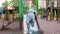 4k video of little toddler boy climbing on metal slide on playground at park