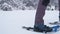 4k video of mountaineer with crampons walking on snow.