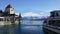 4K video of Oberhofen castle and Berner Oberland mountains.