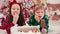 4k video portrait of two cute little children eating Christmas sweets. Craft chocolate handmade sweets in hands of kids