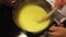 4k video of the preparation of traditional polenta. Stir continuously for a long time on low heat.
