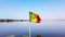 4K video of Senegal flag on the boat waving on blue sky