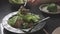 4k video slow motion, Eating spicy liver salad with fresh chili herbs, spices, Thai food.