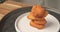 4k video slow motion stock footage, rotating and close up nuggets chip fries stack on white plate. party snack fast food concept.