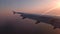 4k video of the sun setting behind an aircraft wing on approach to Luga Airport in Malta