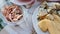 4K video, top view of the assortment of appetizers on plates, seafood, cheese, tomato, homemade bachelor dinner