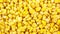 4k zoom in out Fresh frozen corn background, Stocking up vegetables for winter storage, Tasty yellow grains of corn