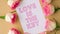 4k zoom in out LOVE IS THE KEY text on greeting card paper note. Delicate pink roses on beige background. Minimal trendy