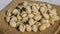 4k zoom in out Pistachios in burlap sack on concrete table. Organic pistachios. Vegan Healthy food high protein. Dietary