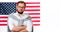 4th of July. Smiling young man on United States flag background.