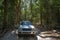 4WD Fraser Island Driving on Sandy Rainforest Road on Great Sandy National Park, Queensland Australia.