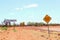 4wd gravel road, traffic warning signs, desert Australia