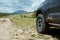 4WD vehicle parked alongside a mountain road