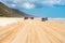 4wd vehicles at Rainbow Beach with coloured sand dunes, QLD, Australia