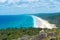 4wd vehicles at Rainbow Beach with coloured sand dunes, QLD, Australia