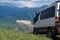 4x4 offroad van Mersedes-benz Sprinter on mountain valley. Off-road travel, journey in motorhome concept