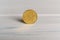 A 5 cents Swiss coin standing on a wooden background