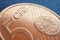 A 5 euro cent coin lies on a dark blue-gray surface. Money close up. Illustration for economic  financial  banking news. The