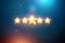5 gold stars on a blue background, assignment of a new rating, service rating, a new level, business concept. Mixed medium. 3d