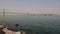 5 oct 2022 - Lisbon. Portugal -Bridge of 25 april - view of Lisboa Harbor with vessels and Port cranes