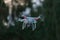 5 - UAV remote control white drone hovers with plain background