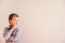 5 year old boy with very expressive thoughtful gesture, on white background with copy space area